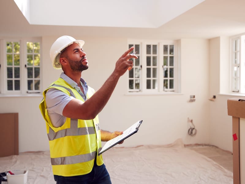 Surveyor inspecting a property